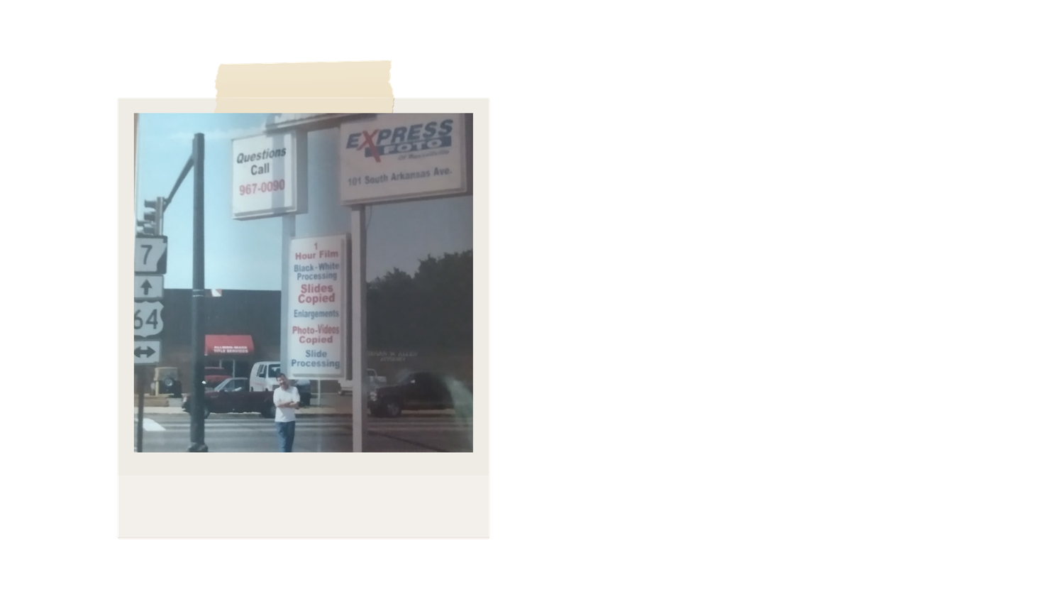 Vintage polaroid-style photo of a storefront with signage on a sunny day.