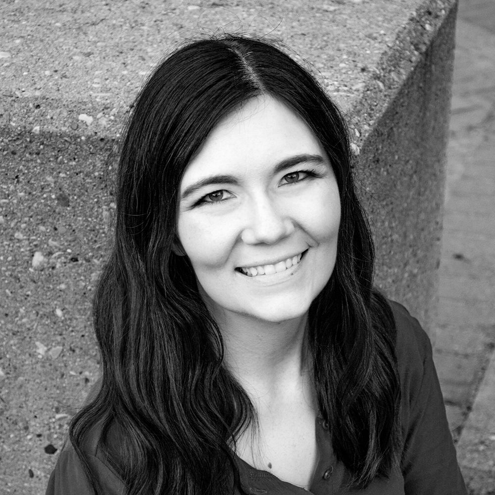 headshot of Amanda Swanson, the owner of Amanda Swanson photography taken in Edmonton Alberta during cherry blossoms season, may, spring