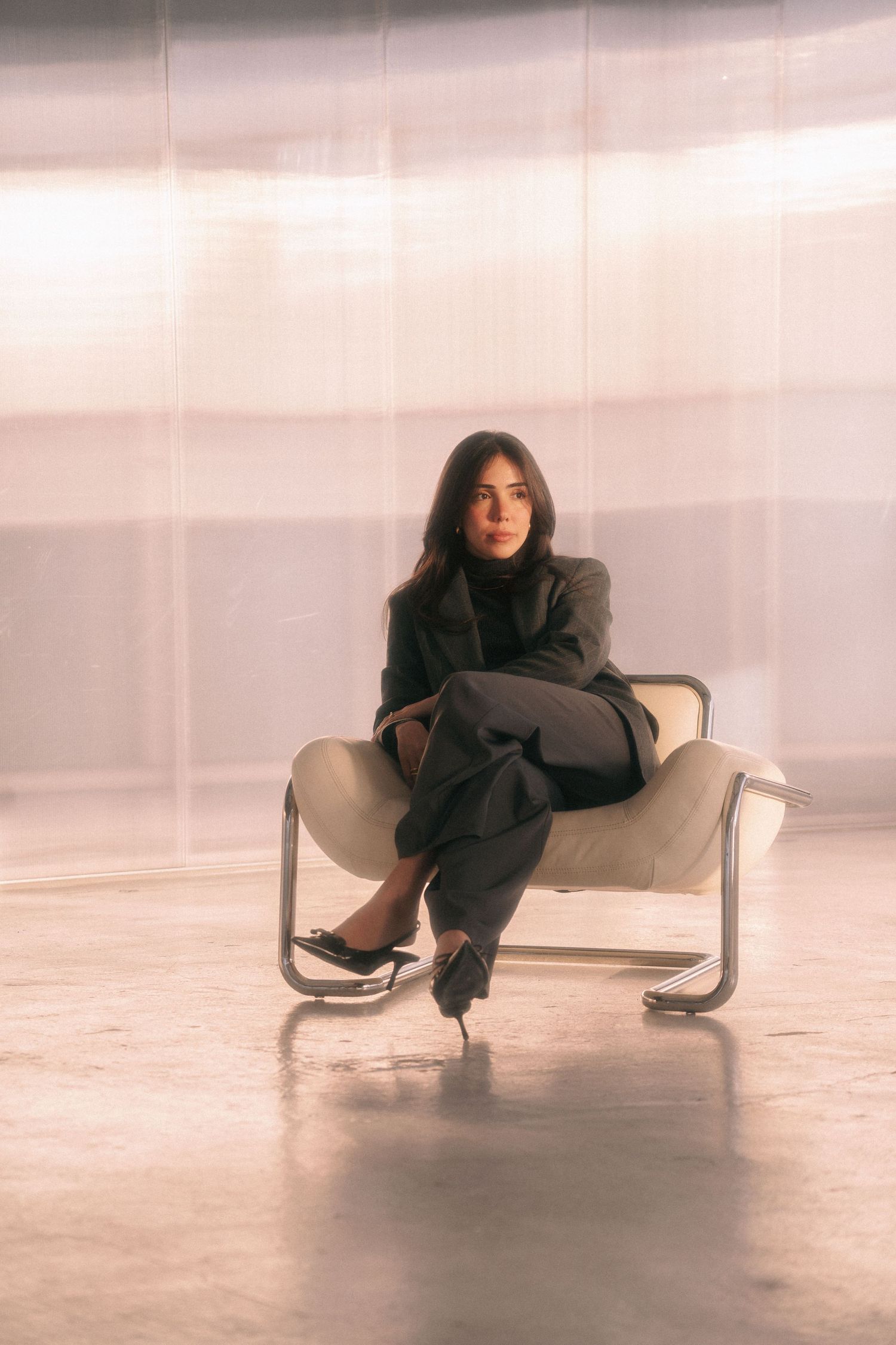 Personal branding photography for a doctor showcases a fashion portrait in dreamy lighting, featuring a doctor in a black outfit.