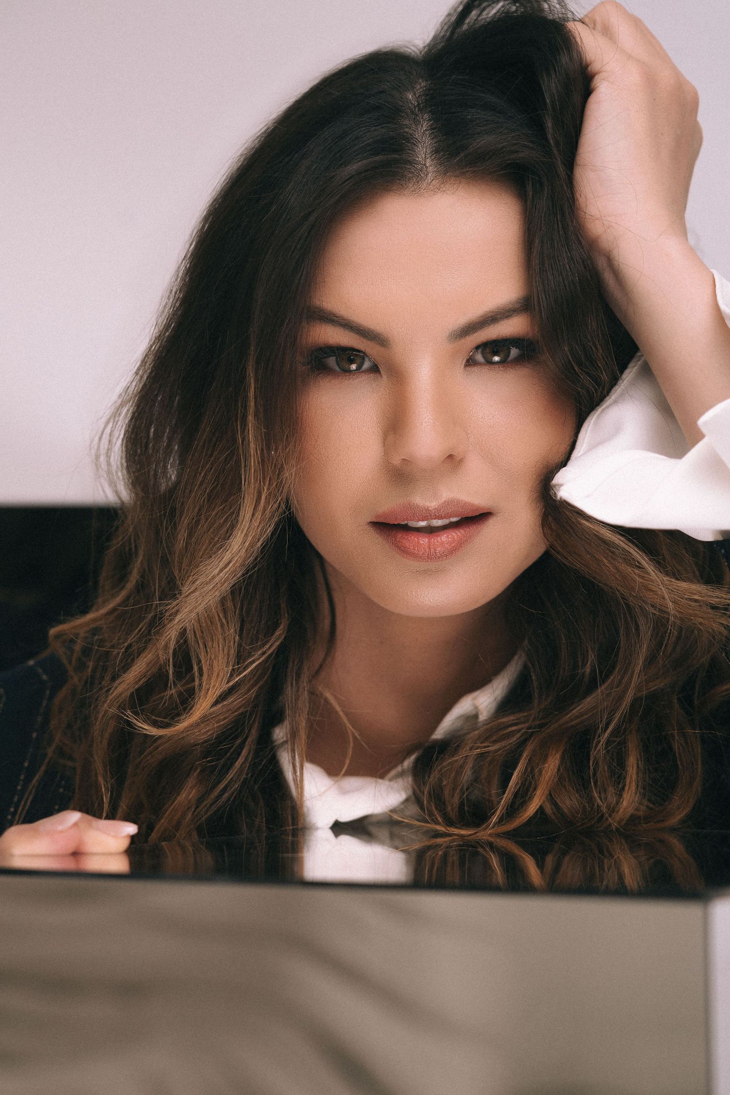 Branding Photography Sessions featuring a makeup artist entrepreneur with long wavy brown hair, showcasing storytelling brand imagery
