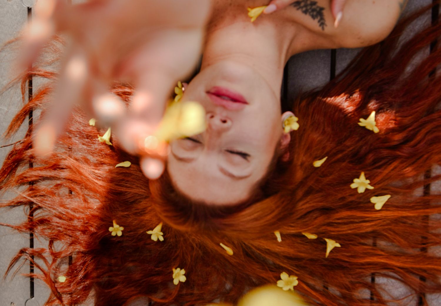 Abstract artistic portrait with golden bokeh lights and warm tones.