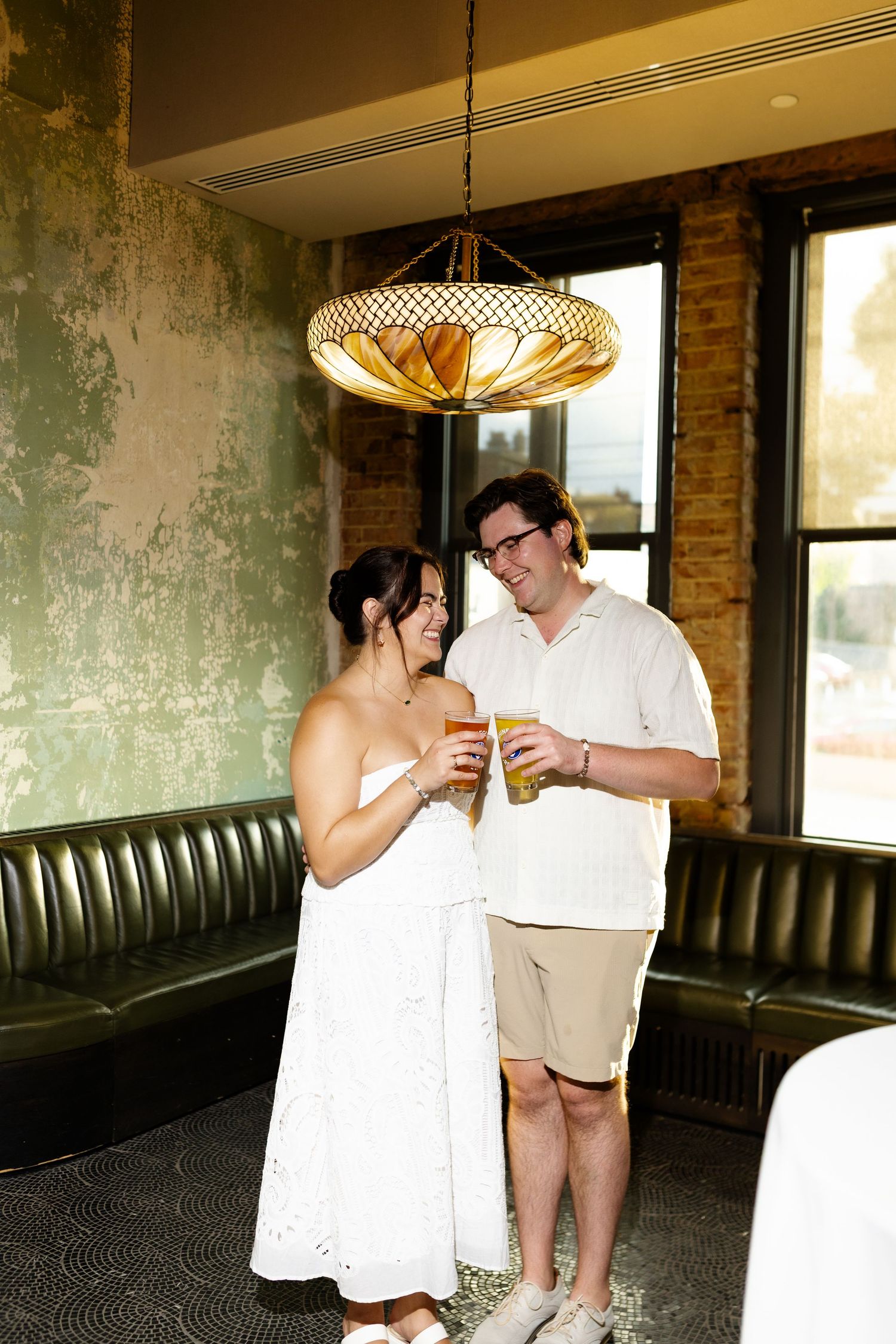 newly engaged Cincinnati Ohio couple smile for the reception dinner session