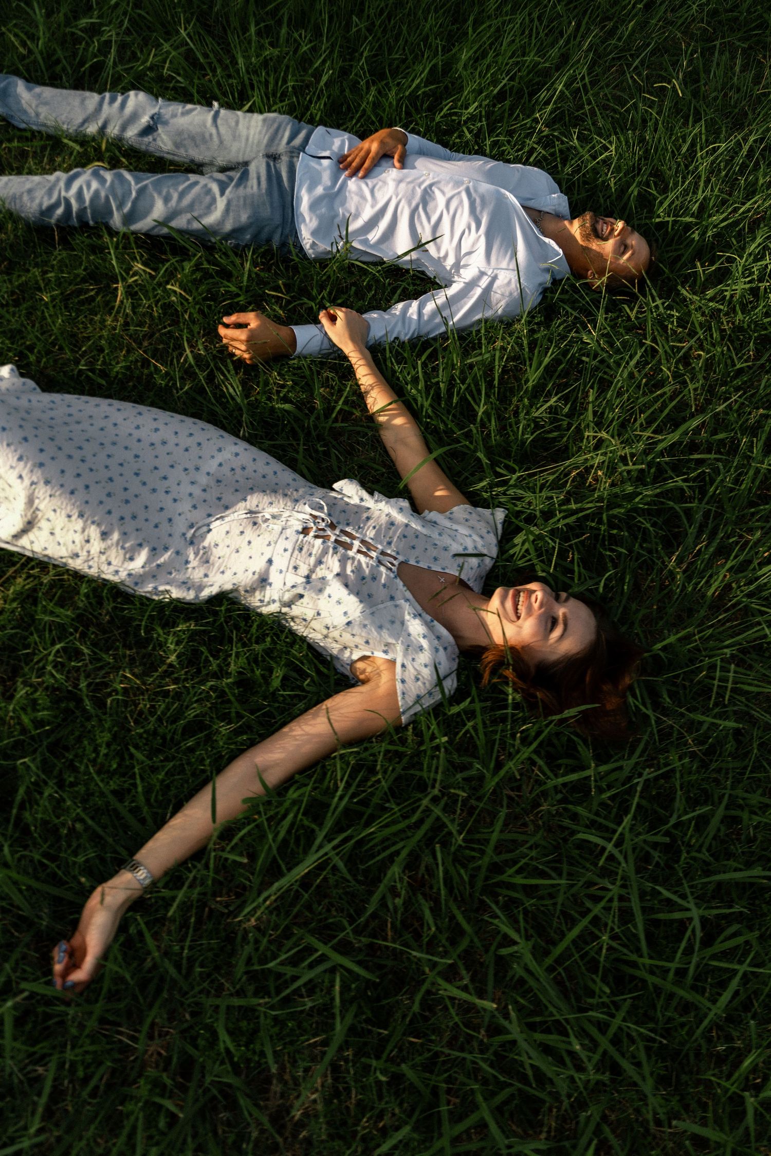 Young Ohio couple lay in the grass of their Cincinnati home