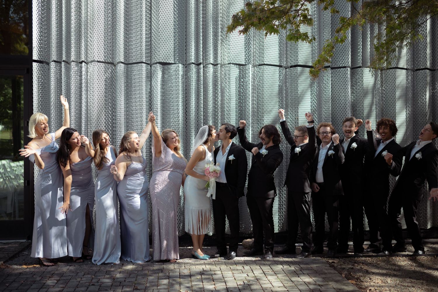 wedding photographer in Cincinnati Ohio photographs of the bridal party cheering