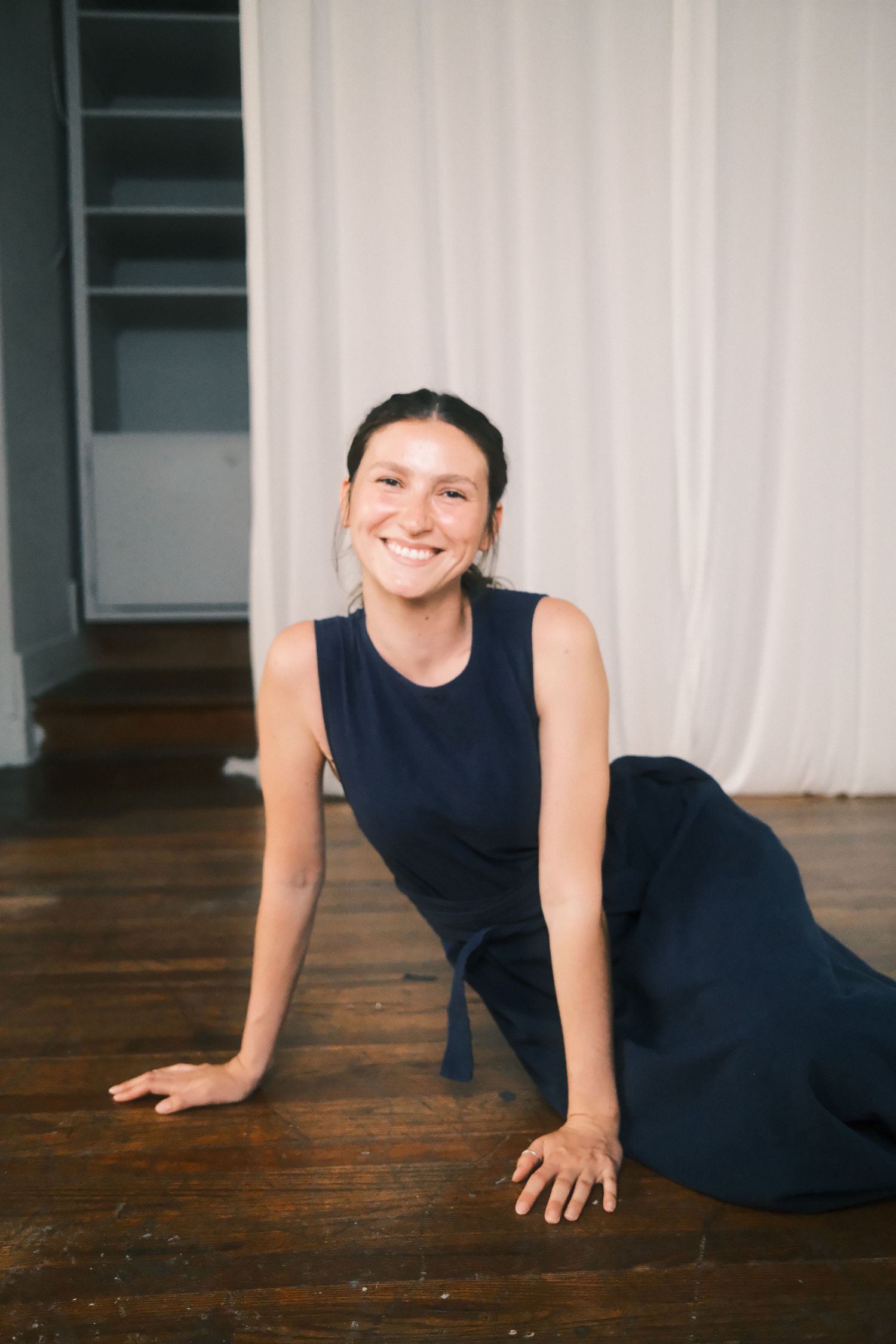 Artistic Cincinnati ohio photographer poses for portrait session indoors