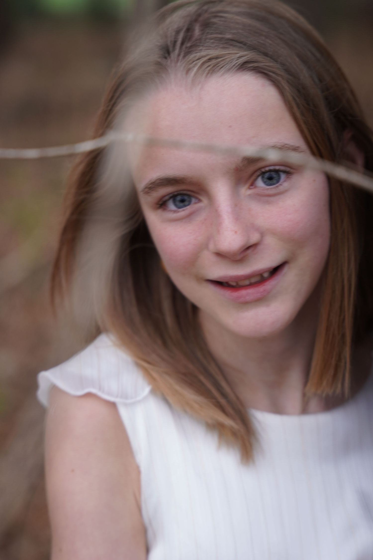 Close-up portrait shots with natural lighting and warm expressions against a blurry background.