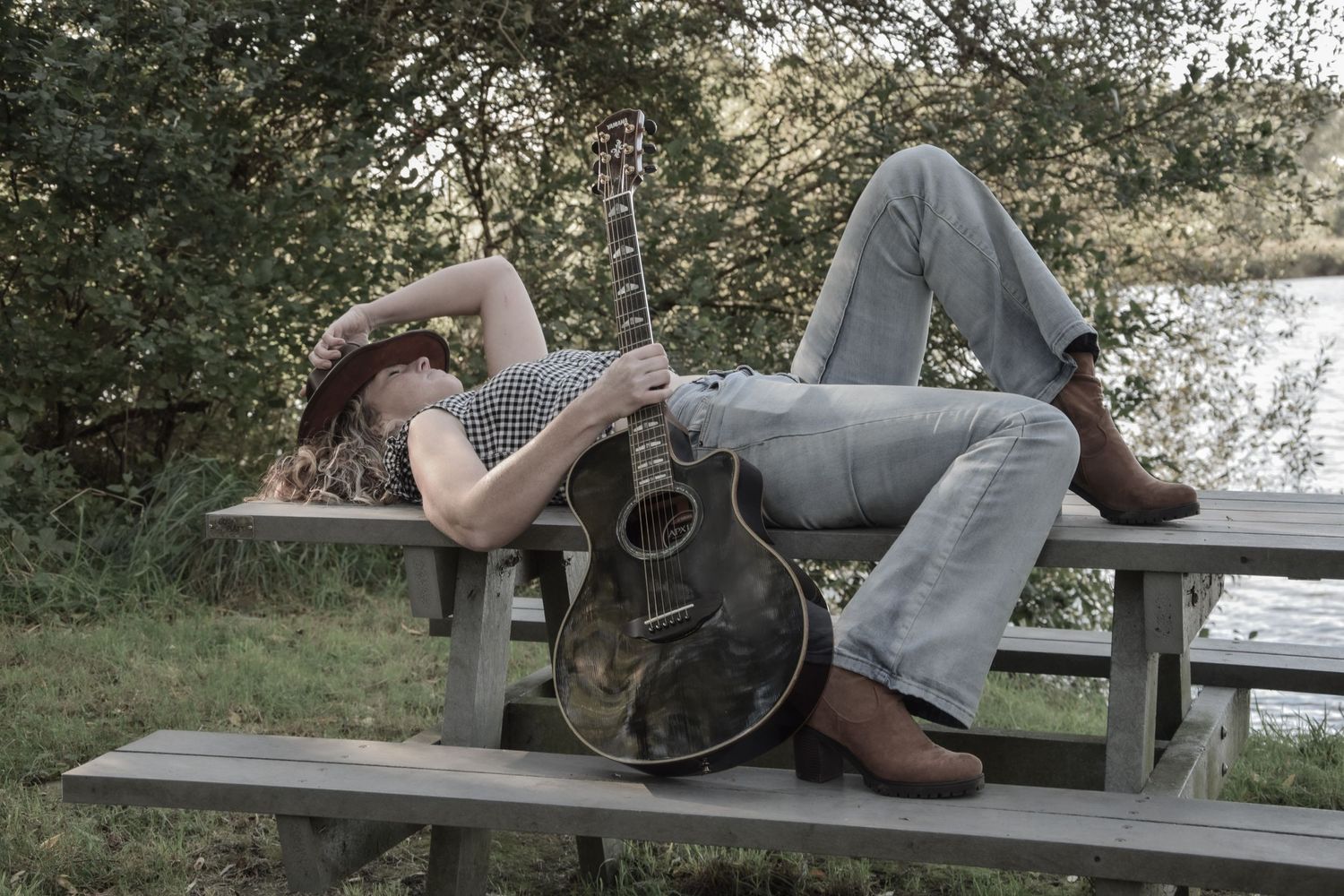 A sequence showing someone reclining on a wooden bench outdoors.