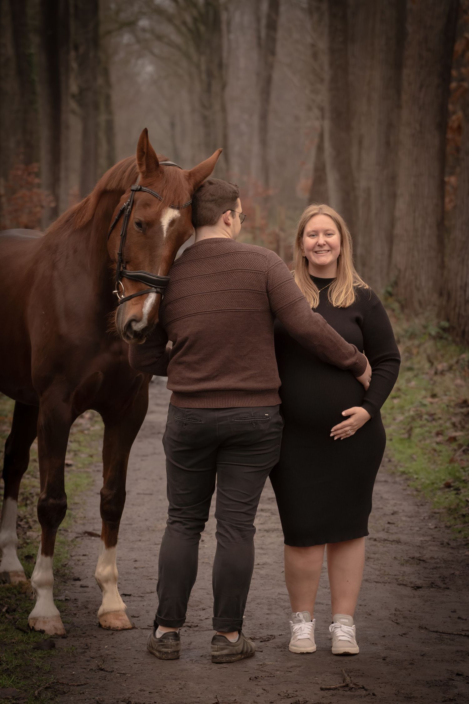 Two people and a brown horse walk together on a misty forest path shown in a series of connected photos.