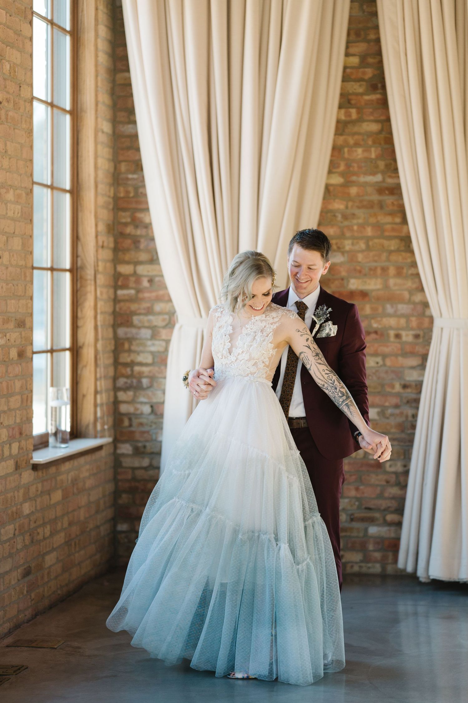 A romantic wedding dance sequence showing the bride's ombre blue and white gown twirling gracefully. - The Brix on the Fox