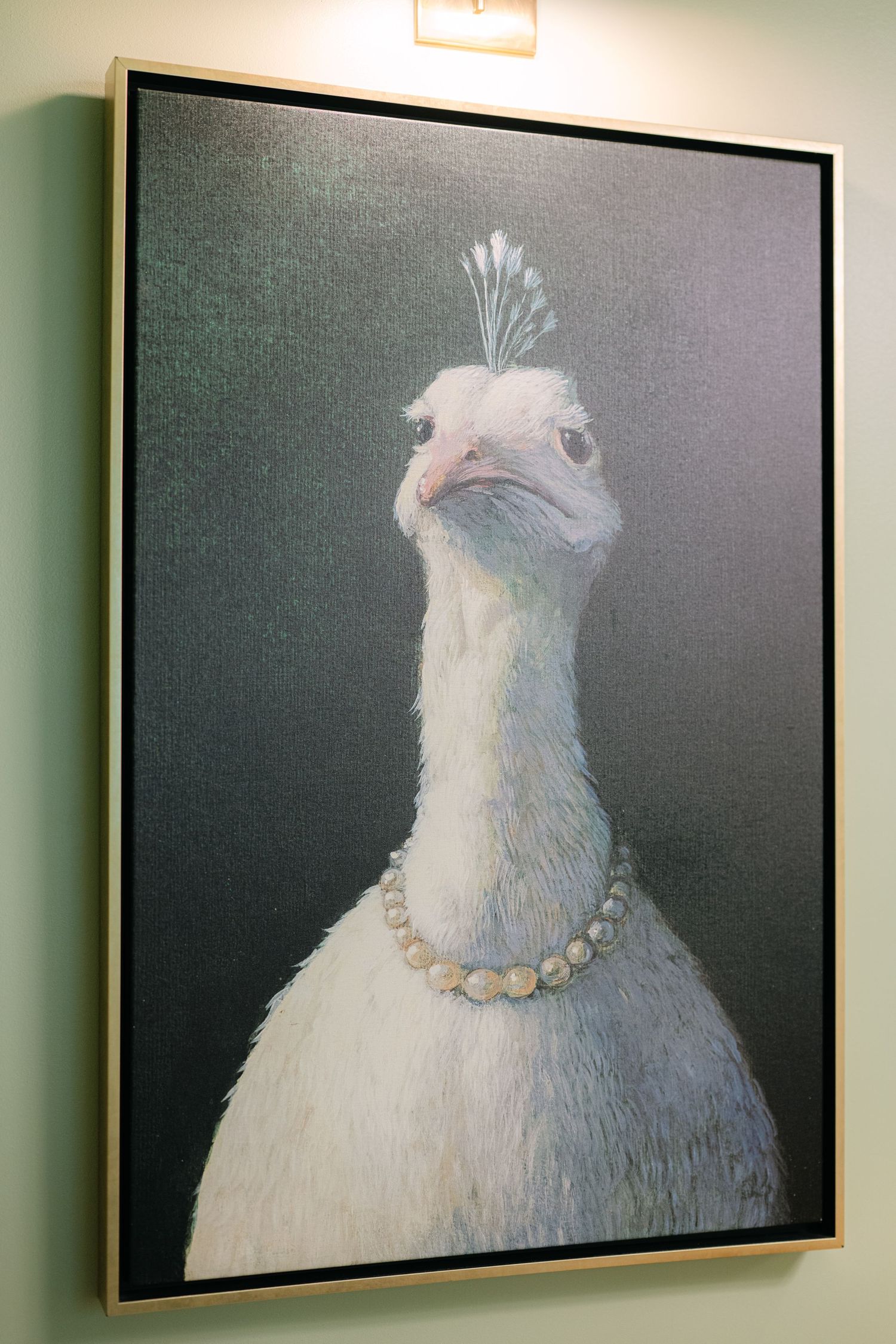 A series of framed artworks showing a white chicken portrait with a pearl necklace against a dark background. - Meyer's Castle Events