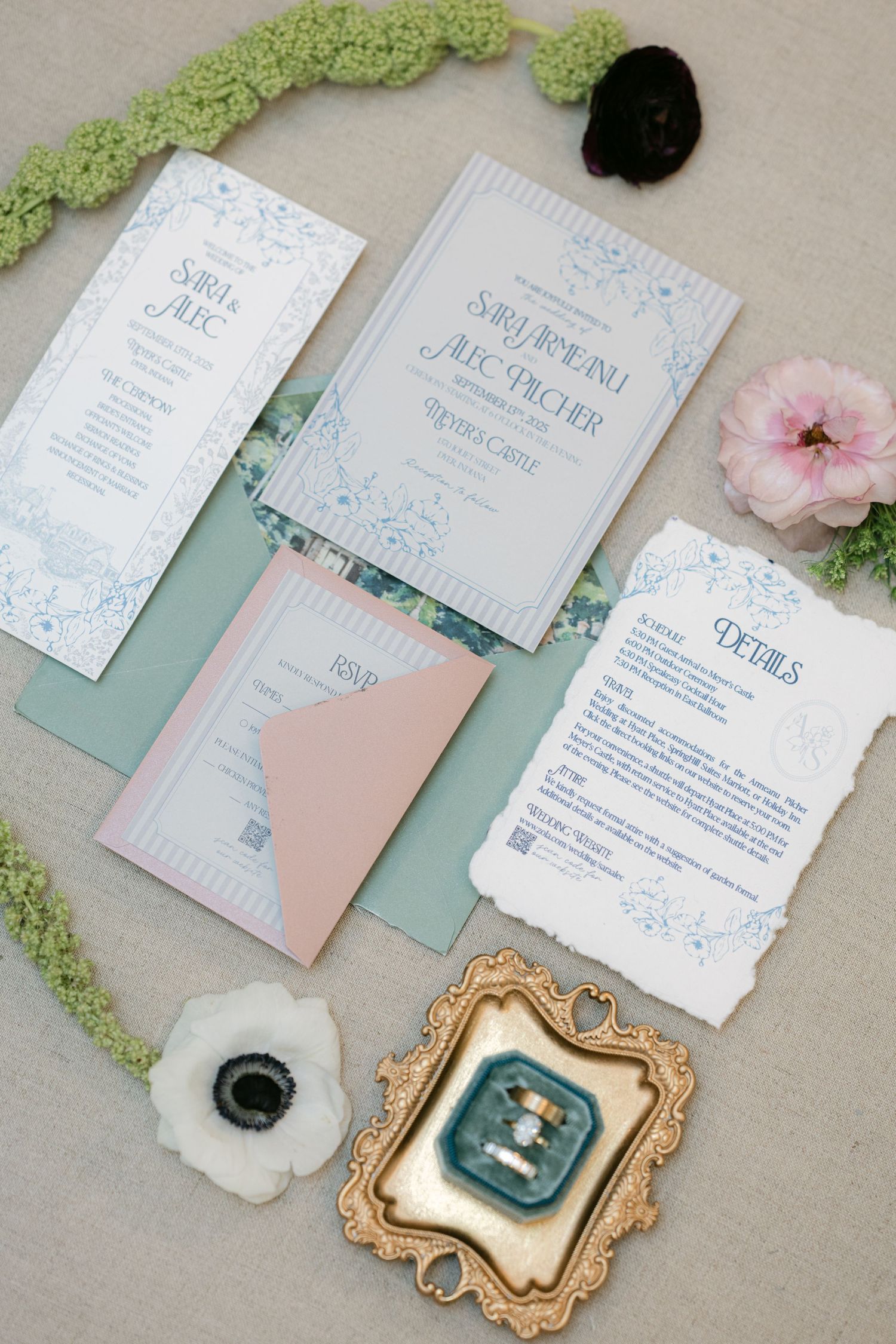 Wedding invitation suite in soft pastel blue and pink with delicate floral designs and gold frames. - Meyer's Castle Events