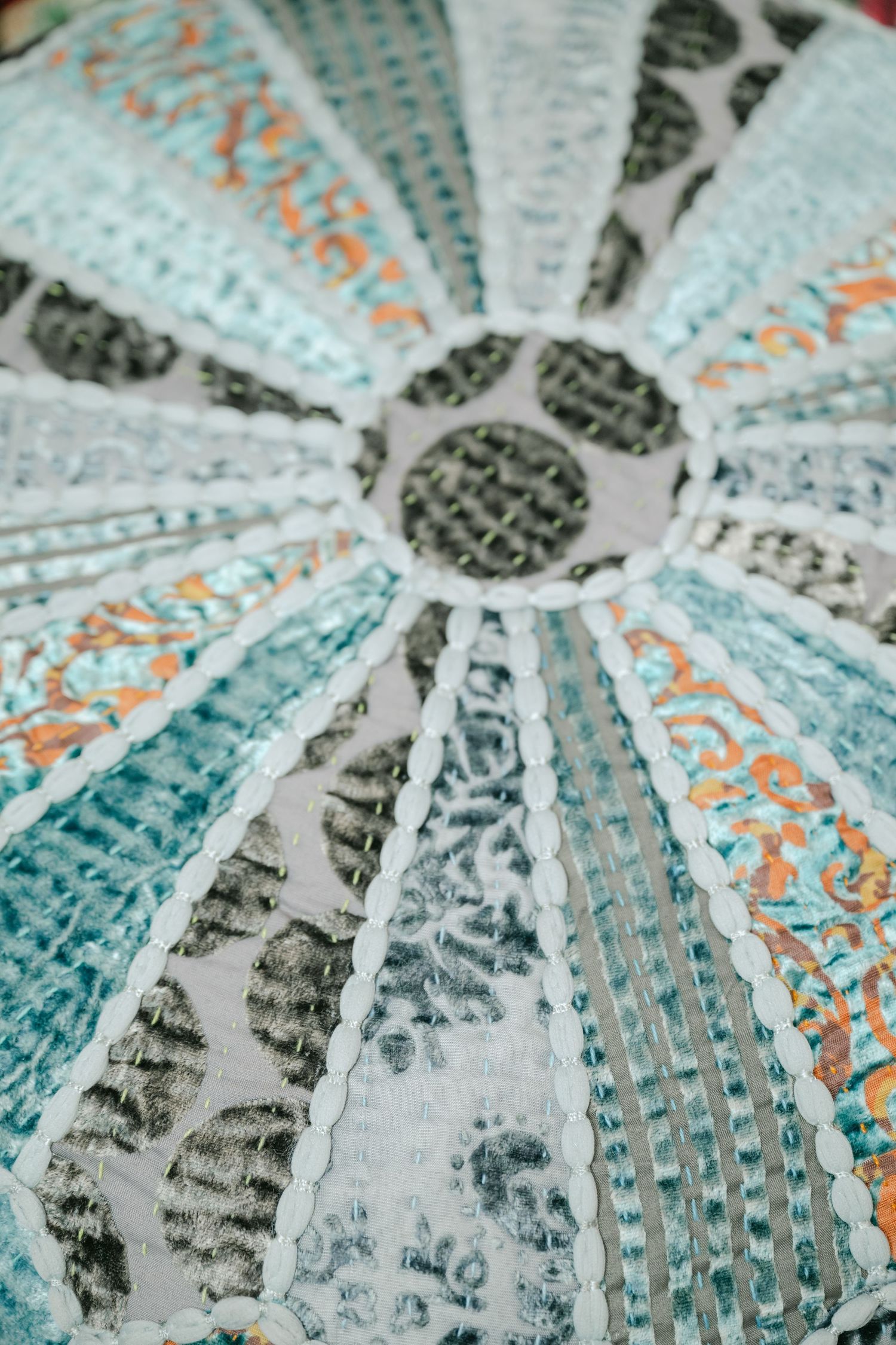 Close-up macro shot of US dollar bills arranged in a circular fan pattern showing intricate details of currency design.