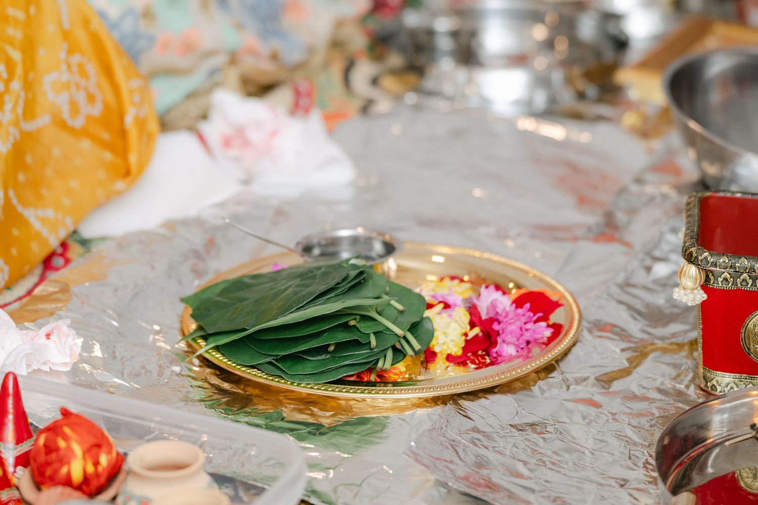 The Brix on the Fox Wedding - A festive table setting with colorful plates, glassware, and floral decorations at a celebration or party.