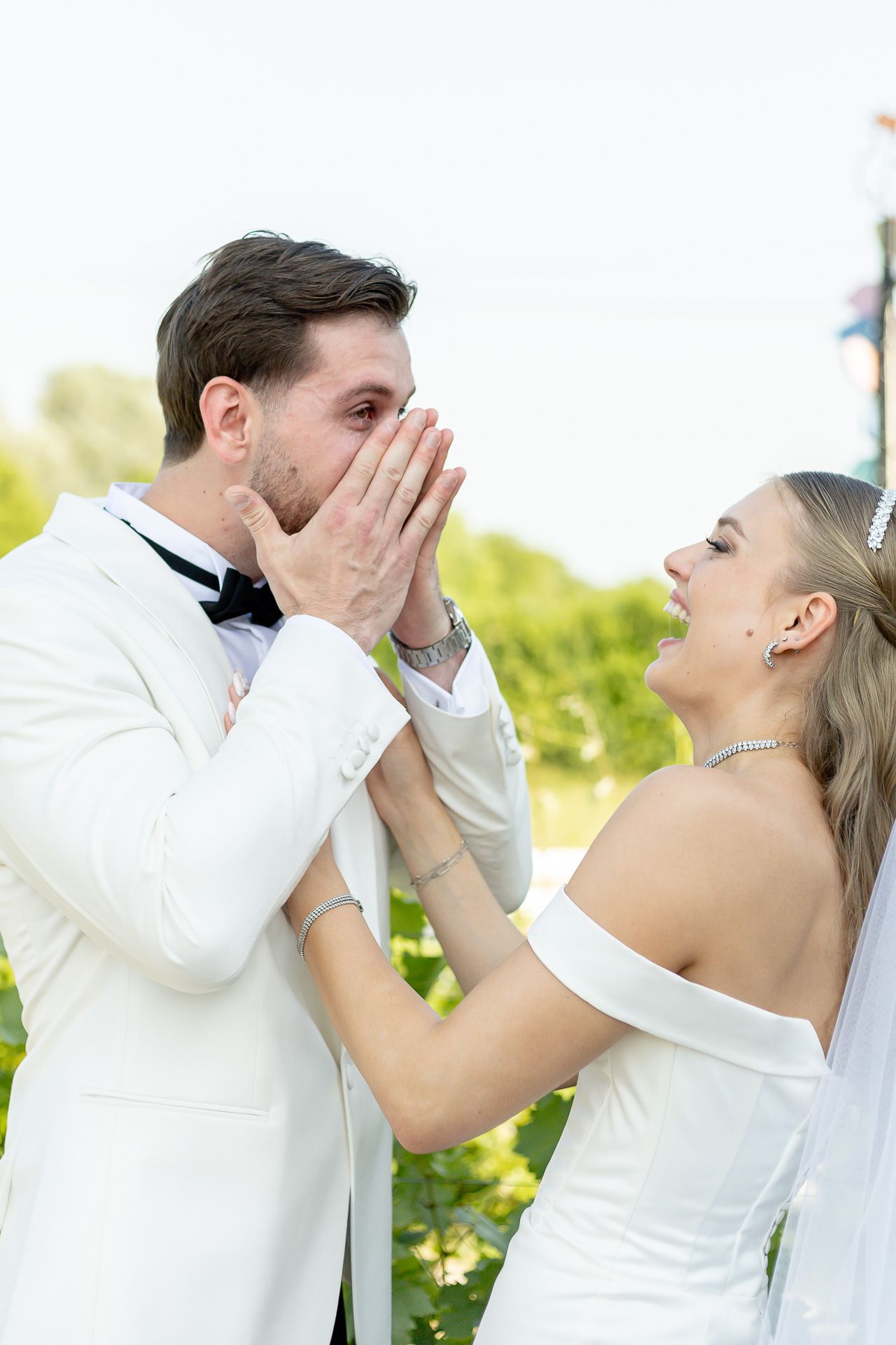 Playful wedding couple shares joyful reactions during their first look.