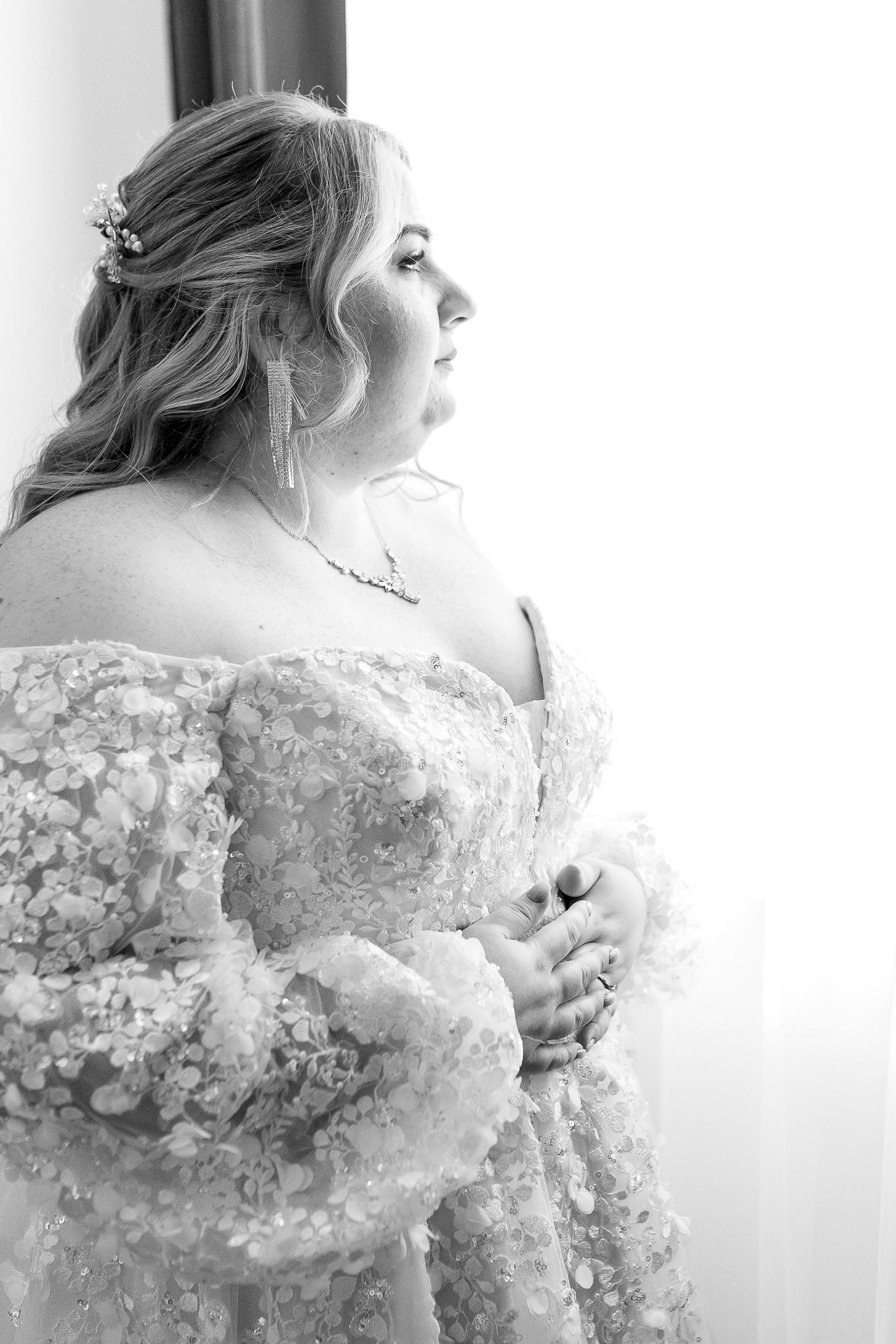 A series of romantic bridal portraits showing delicate lace details and soft lighting in black and white.