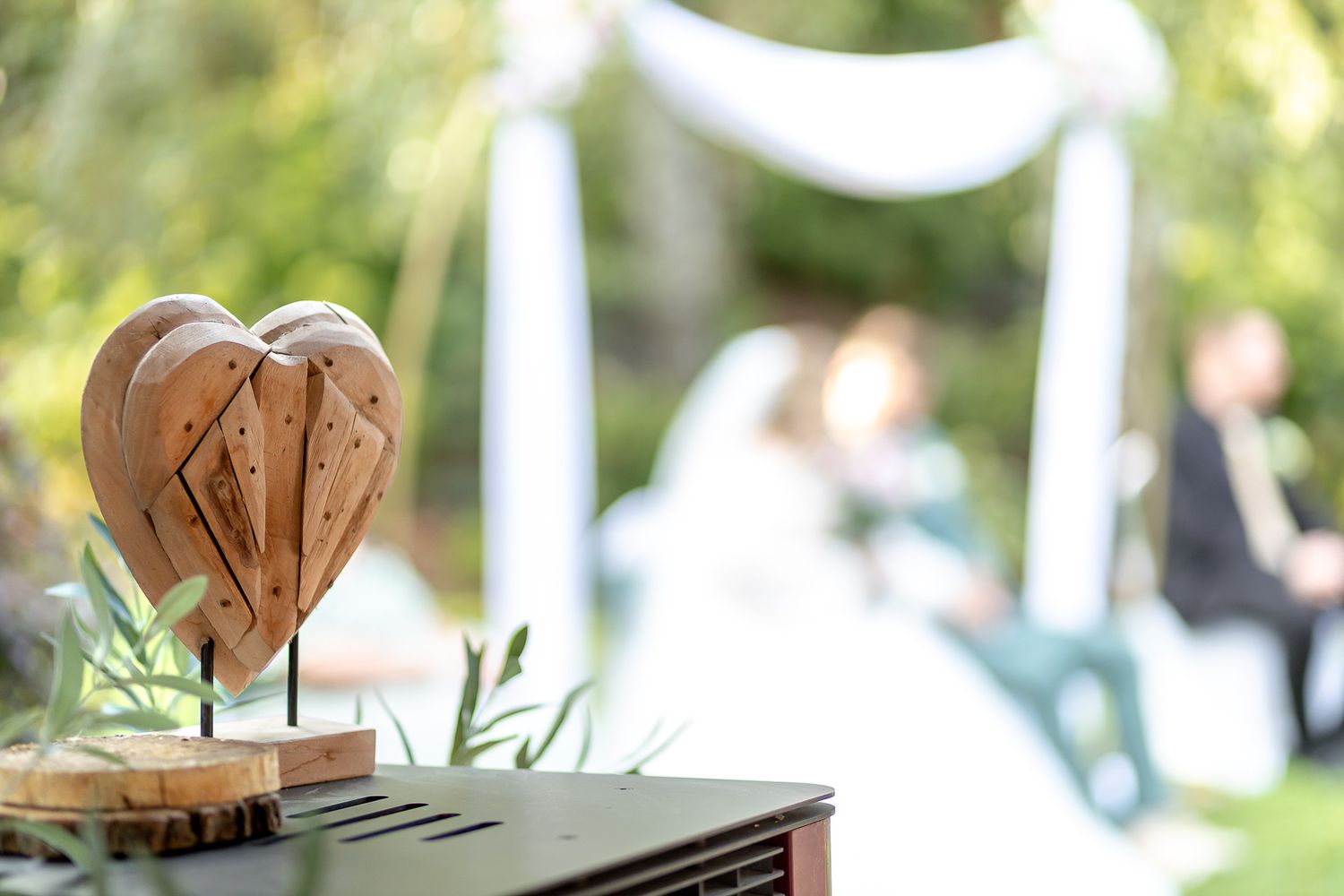 Rustic wooden coasters and serving boards displayed on a white surface with natural light and greenery in background.
