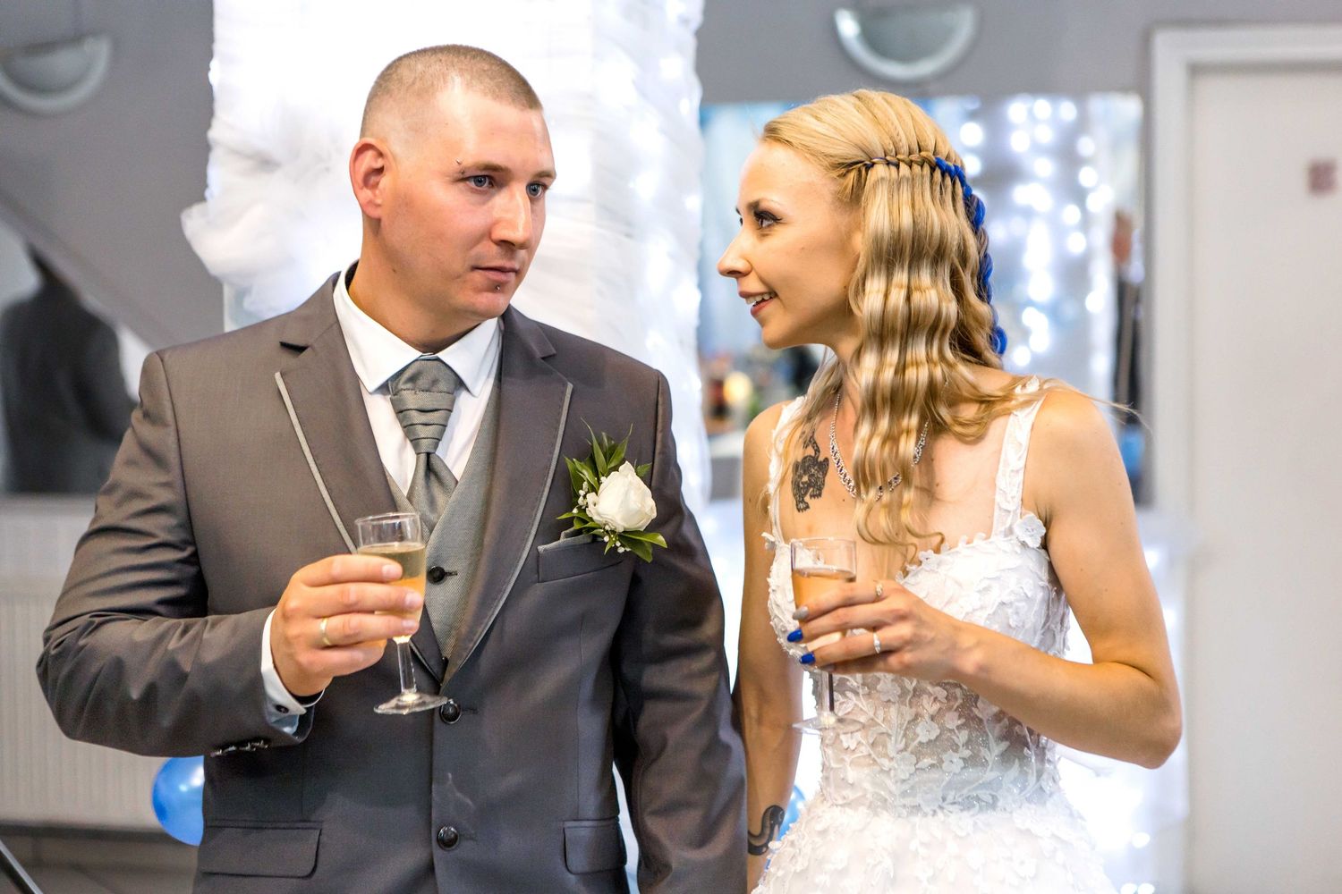 Wedding reception series showing newlyweds sharing drinks and joyful moments in a decorated venue with blue accents.