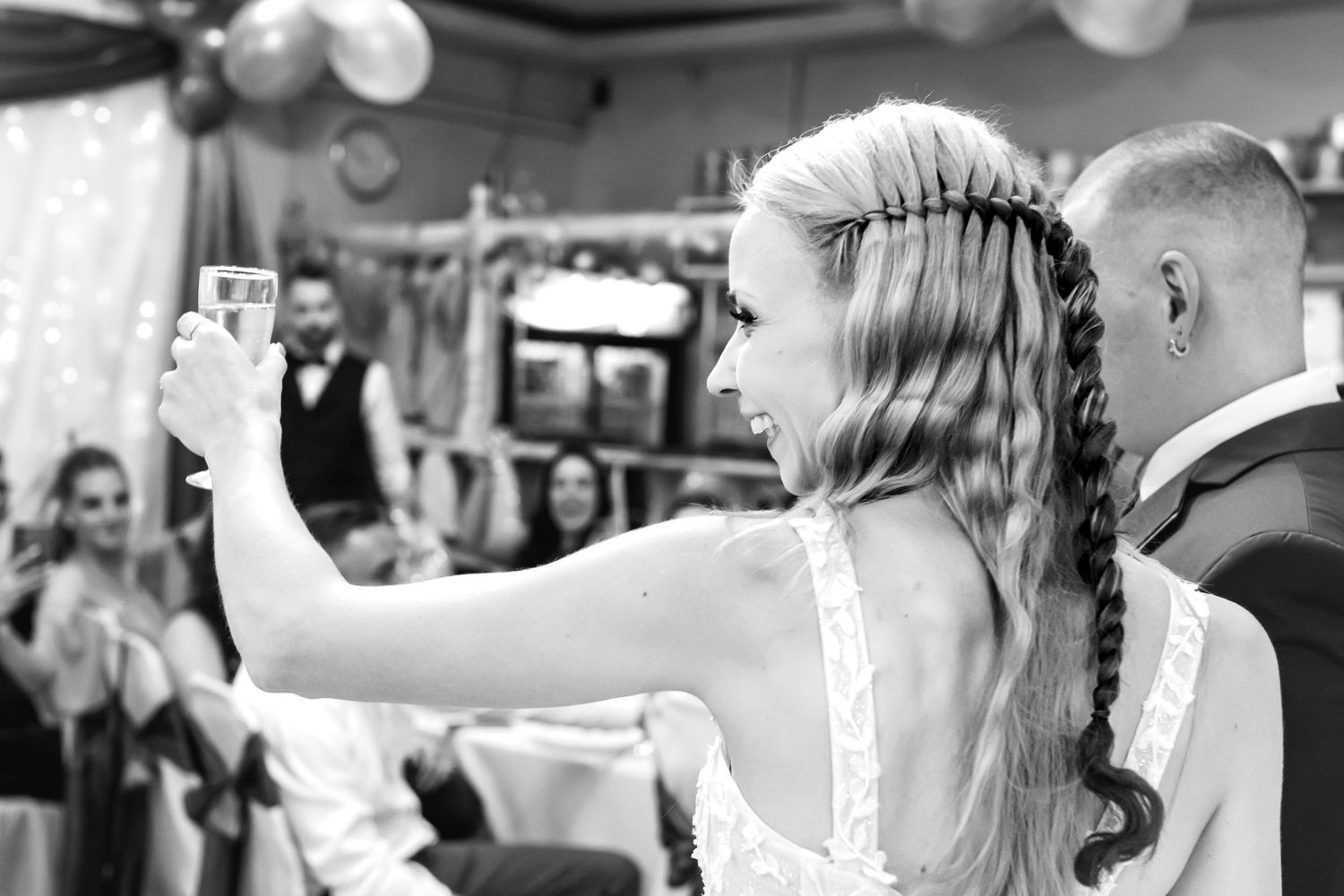 A series of black and white wedding photographs showing intimate moments between a couple during their special day.