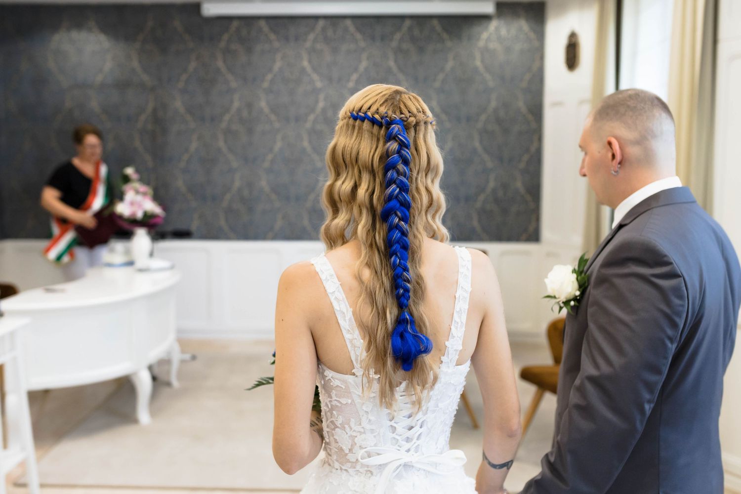 A series of wedding photos showing a couple in formal attire during their ceremony and reception.