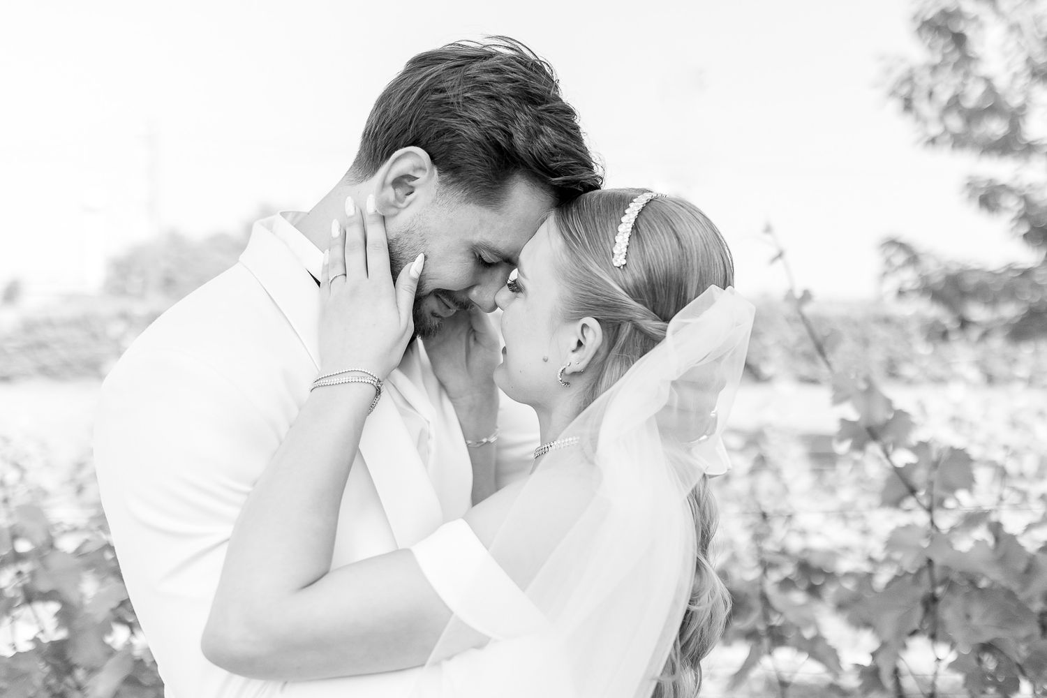 Black and white series of romantic wedding portraits in natural light.