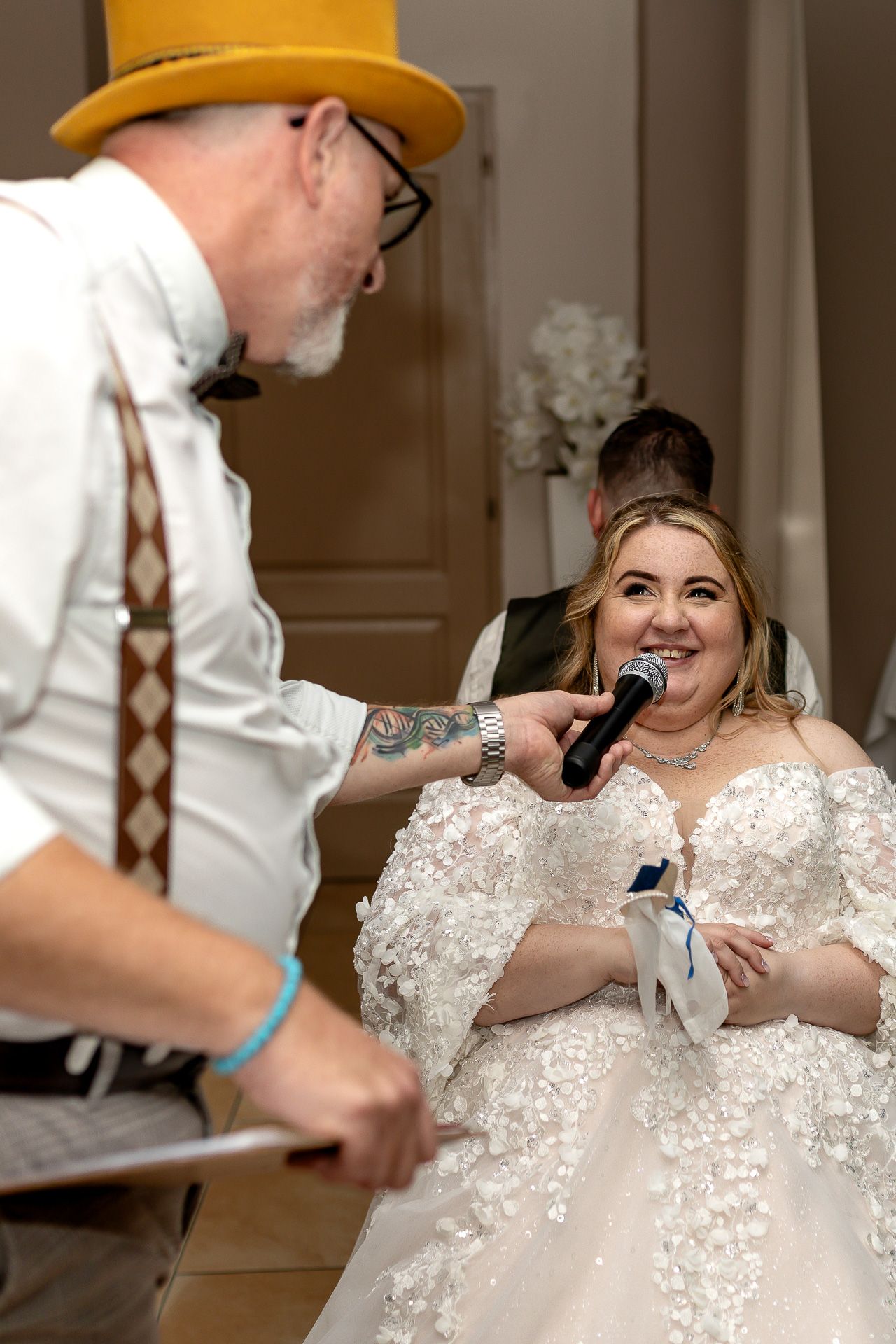 A bride in a lace wedding dress sits while someone in a yellow hat interacts with her in a sequence of candid moments.