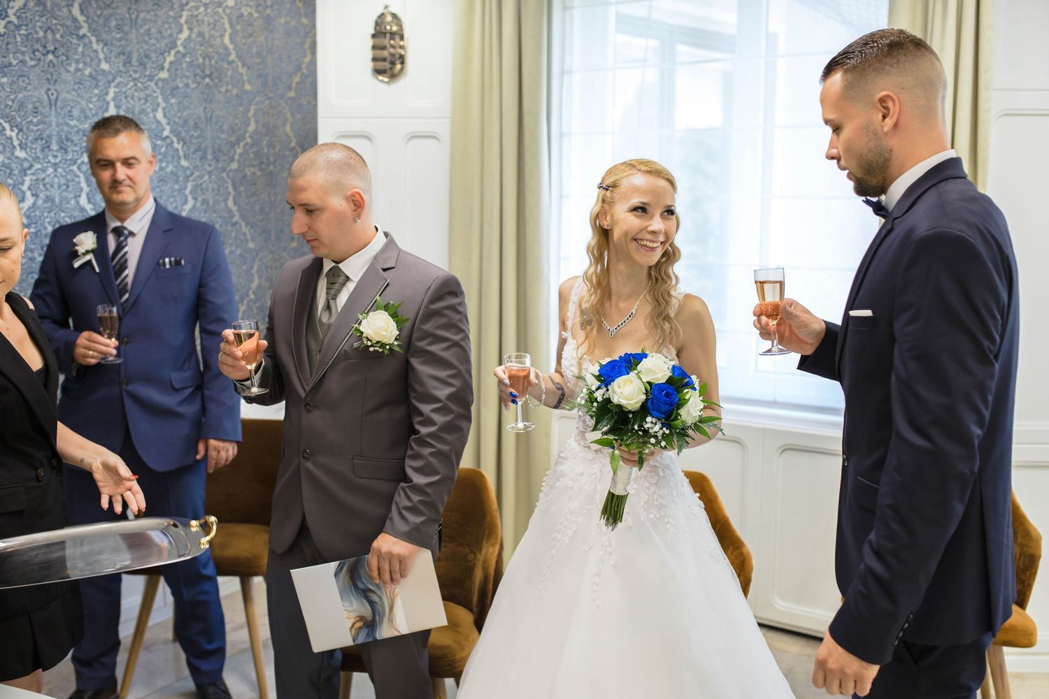 A wedding ceremony and celebration sequence showing various moments in an elegant indoor venue with formal attire.