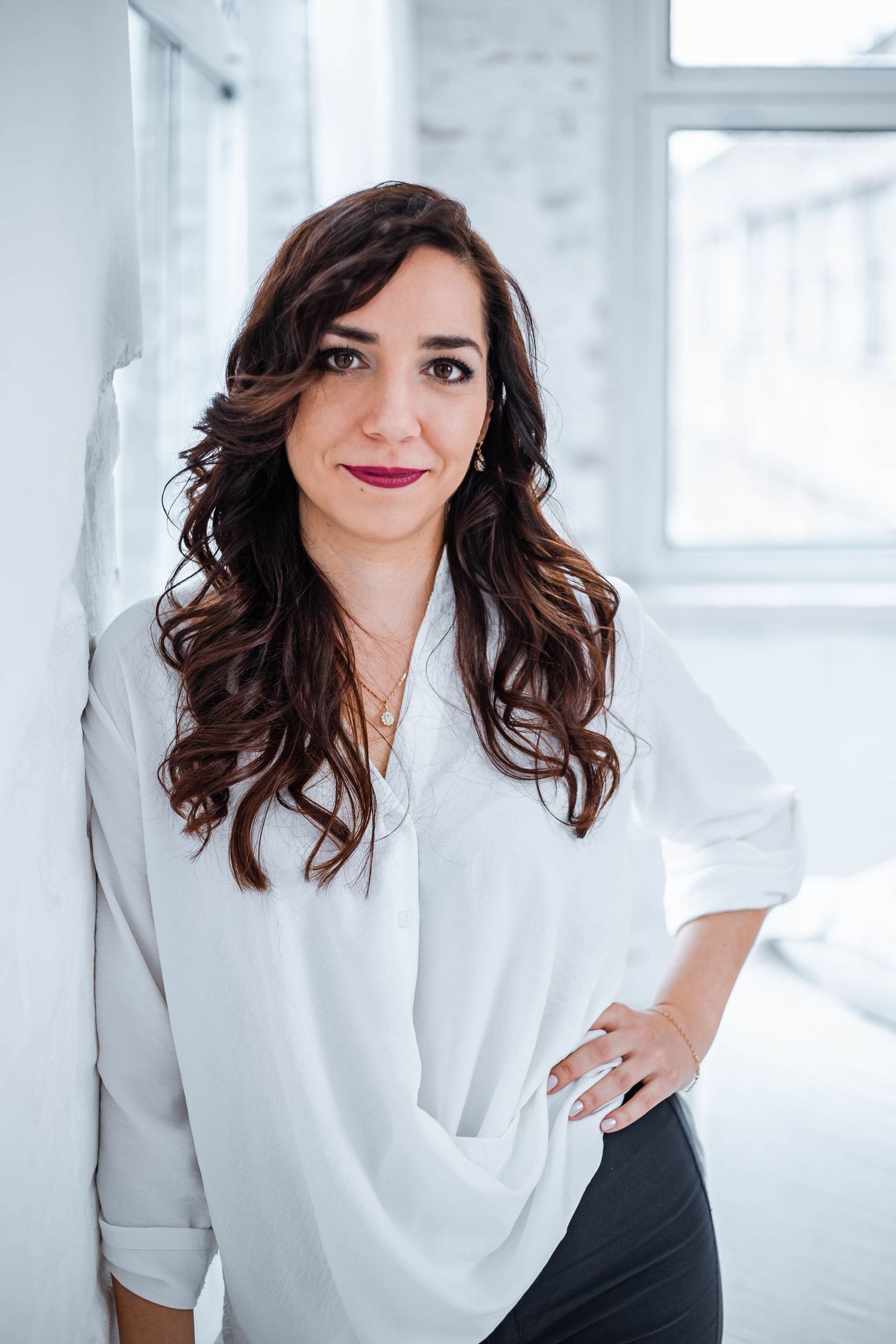 Business portrait series in white shirt showing confident poses against white backdrop.