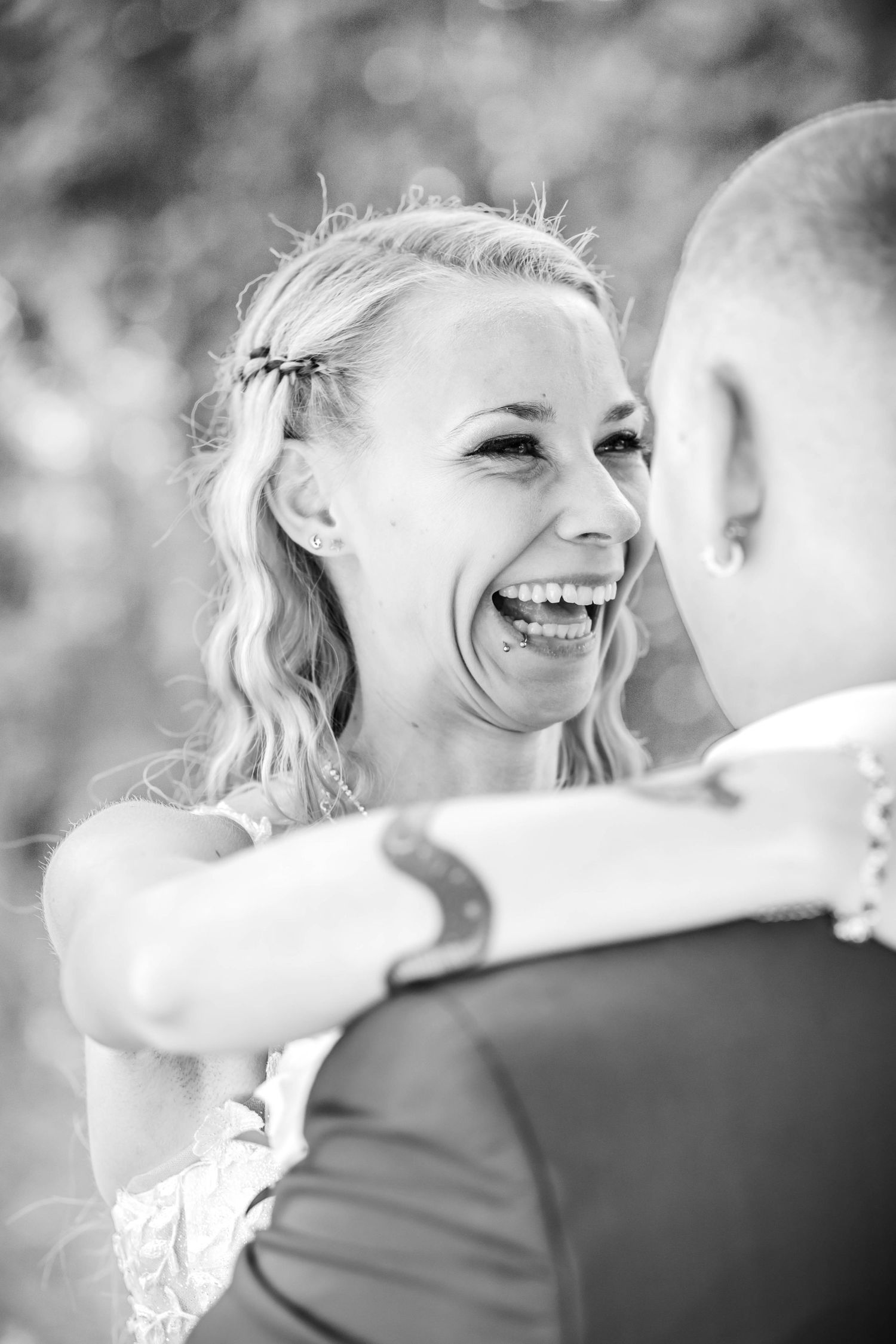 Black and white photo series showing joyful moments between a couple dancing at their wedding celebration.
