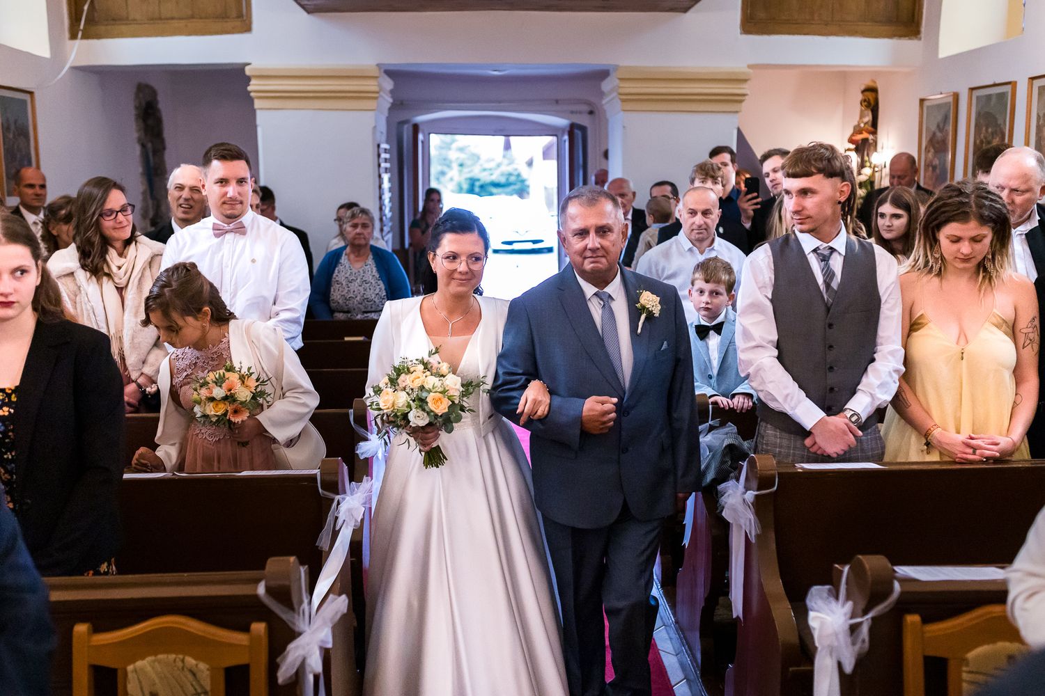A wedding couple and their guests celebrate during a series of joyful moments captured in a church and reception venue.
