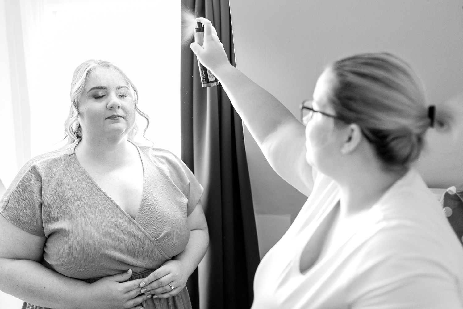 Black and white photo series showing medical professionals performing childbirth procedures in a hospital setting.
