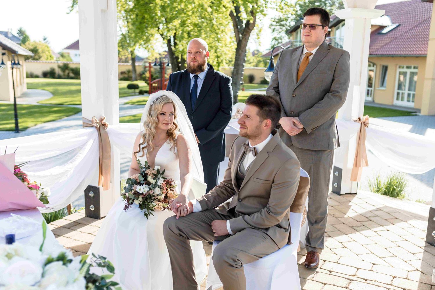 A collection of wedding photos showing romantic moments and celebrations on a sunny day at an outdoor venue.