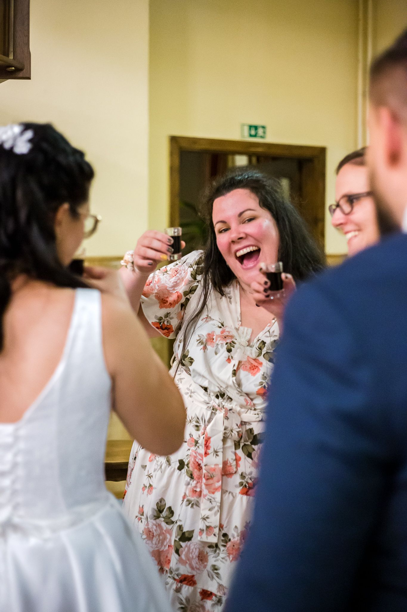A sequence of candid moments showing laughter and joy during an indoor social gathering.