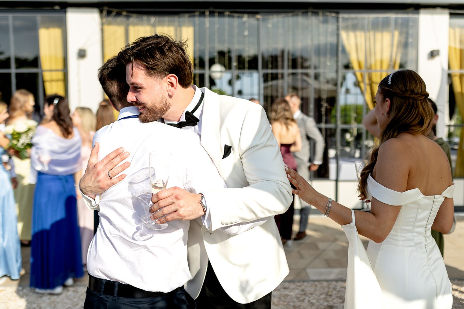 Guests socializing at an elegant wedding reception venue.