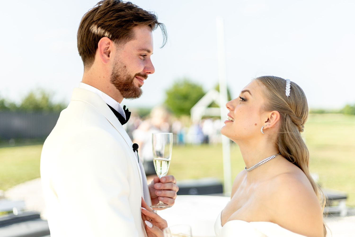 Candid moments of laughter and joy during outdoor wedding reception.