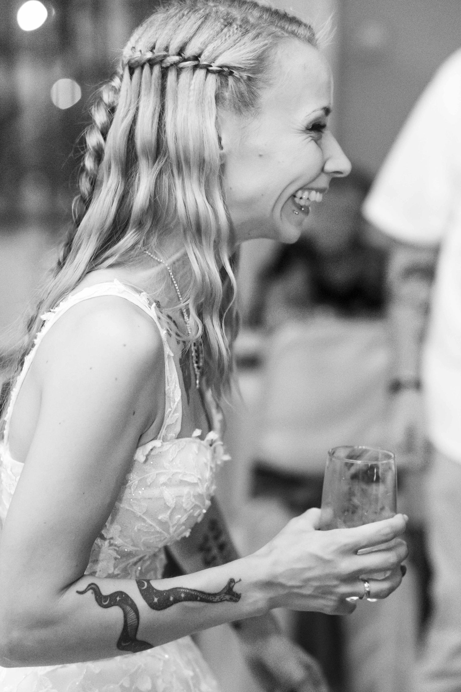Black and white photo series showing someone eating cake at what appears to be a wedding reception.