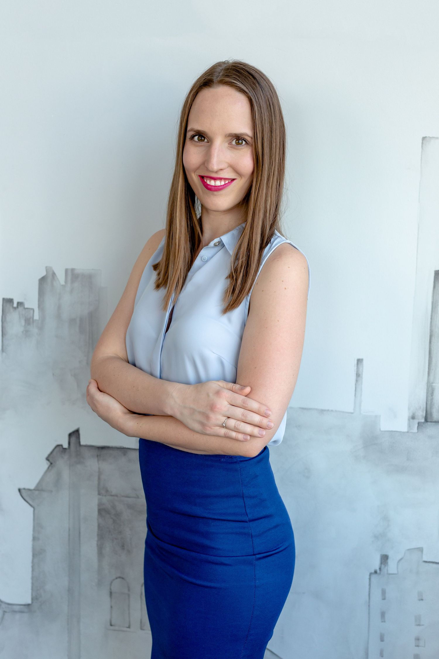 Professional poses against a white wall with urban-inspired watercolor artwork.