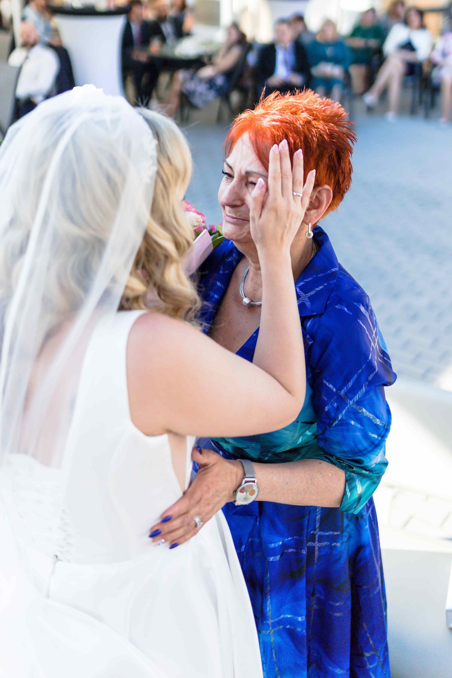 A sequence of photos showing a person in a bright blue outfit interacting with someone in white at an outdoor event.