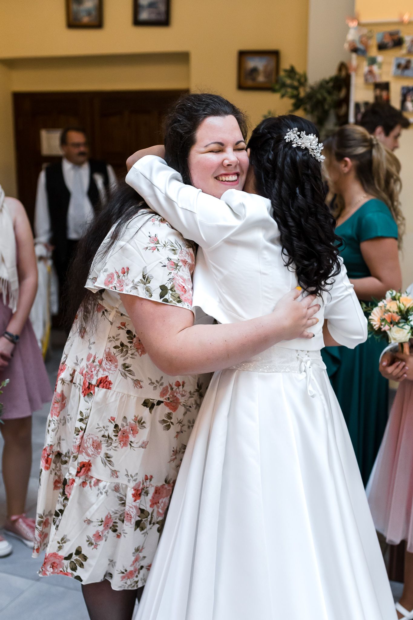 A sequence of three photos showing a warm embrace between two people at a wedding celebration.