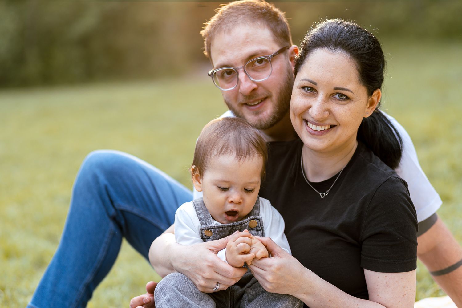 Joyful family portrait session outdoors with natural lighting.