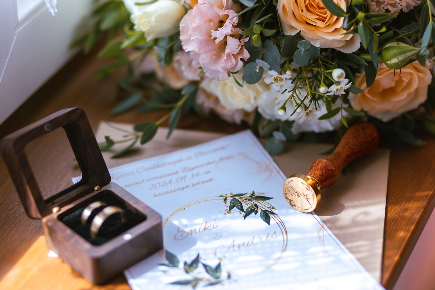 A series of elegant wedding photos showing floral arrangements, table settings, and paper invitations in warm peach tones.