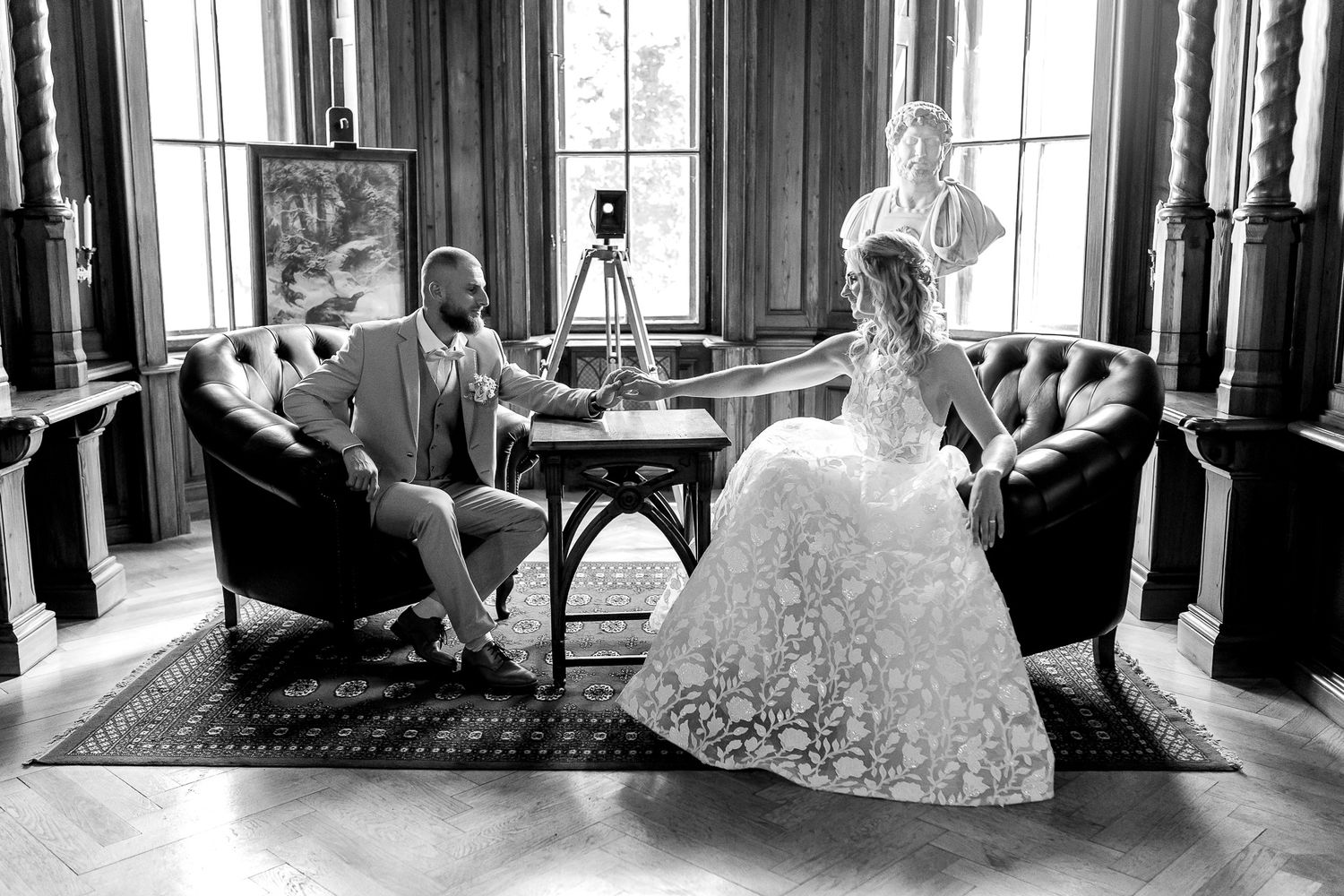 A collection of black and white wedding photos showing brides in elegant gowns posing in various indoor settings.