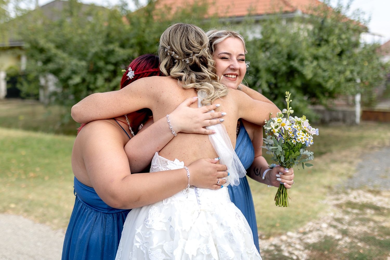 A series of six candid wedding moments showing embraces between people in blue and white attire outdoors.