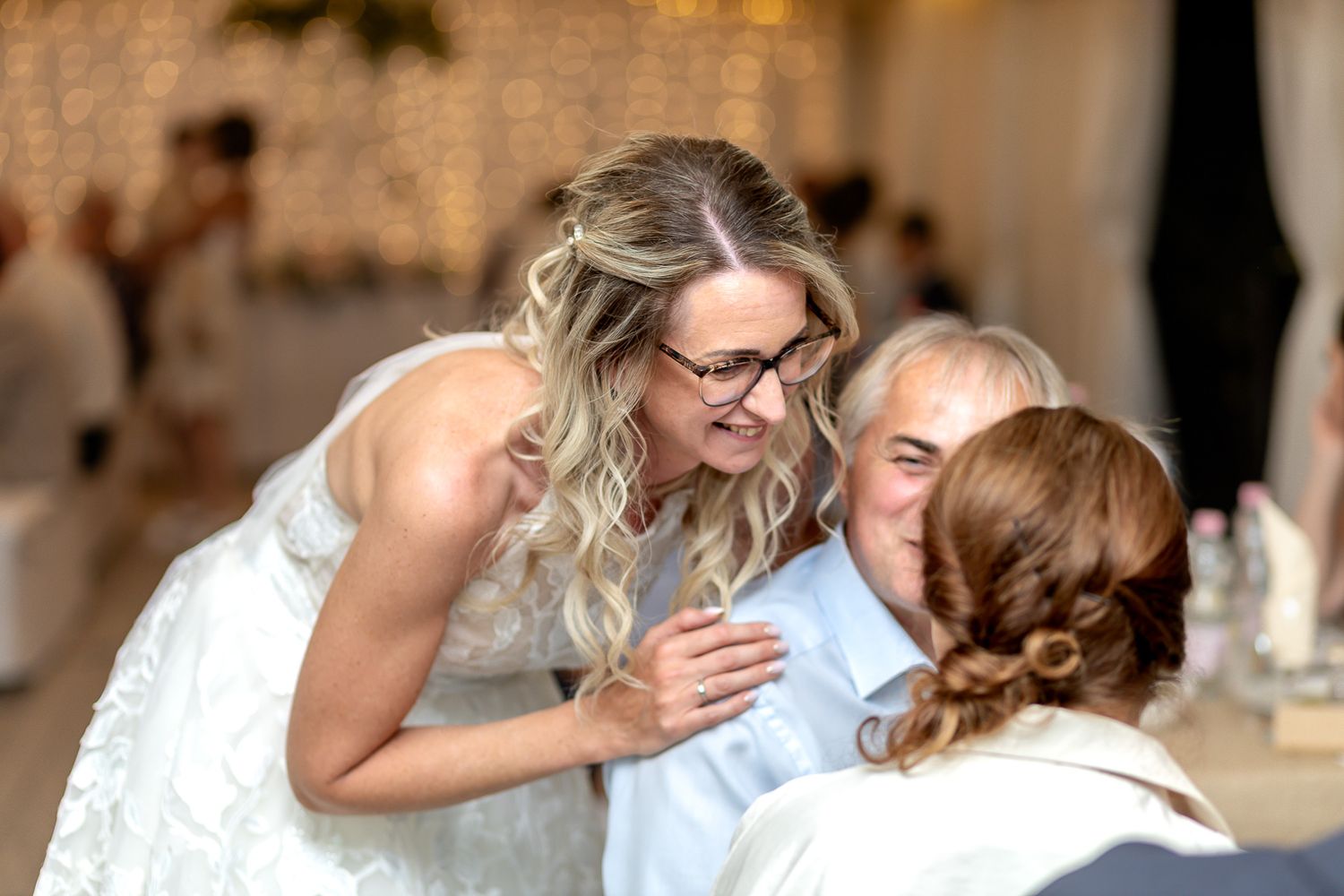 A series of wedding photos showing intimate moments between a couple sharing romantic kisses in an outdoor setting.