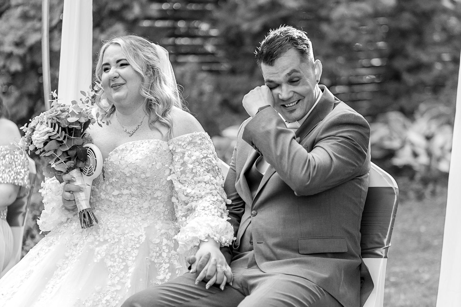 A black and white photo montage of candid moments between a couple at their outdoor wedding celebration.