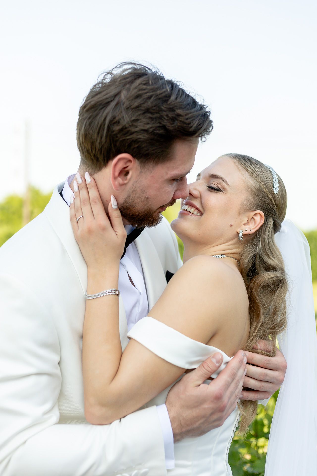 Intimate wedding portraits capture tender moments between newlyweds.