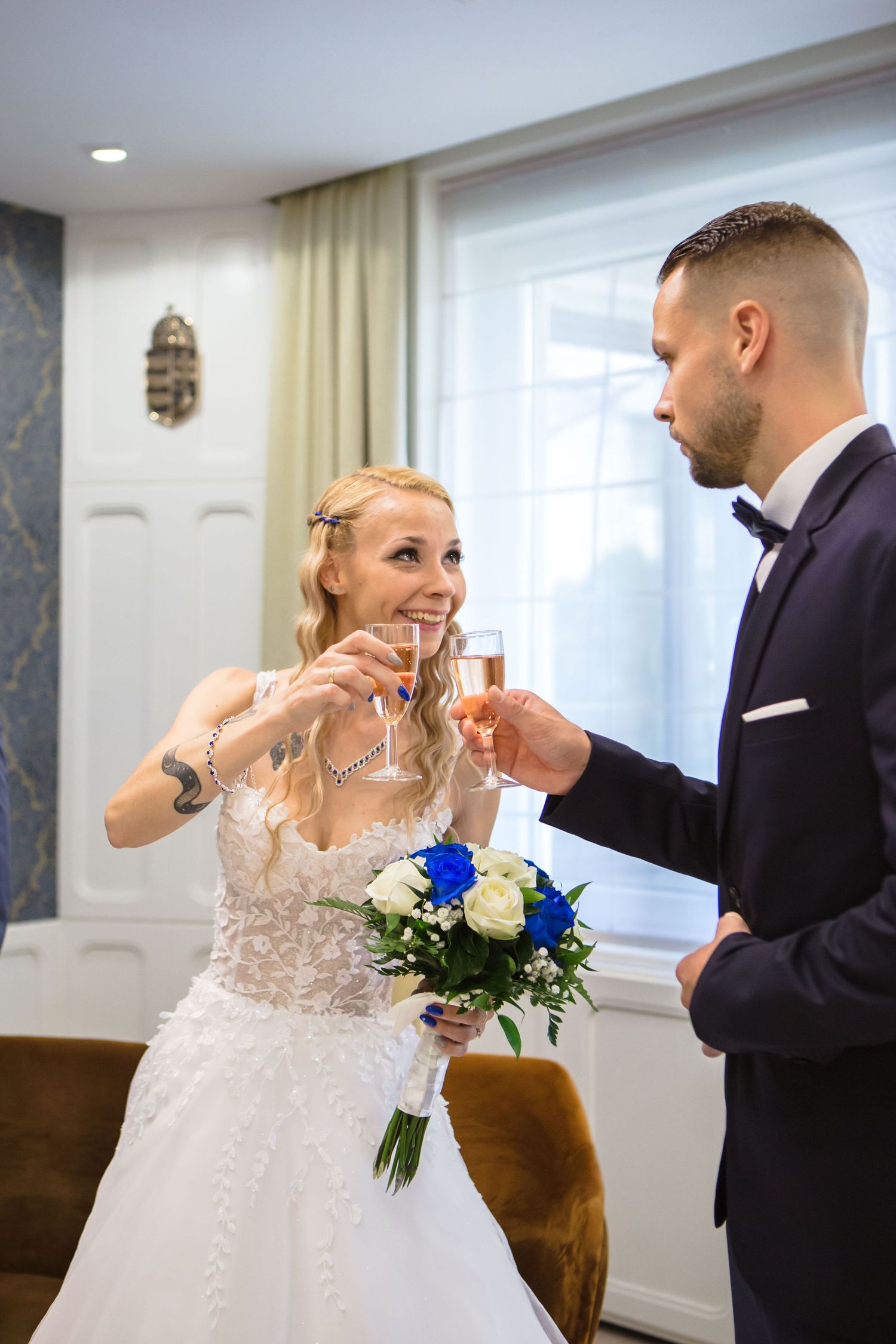 Romantic first look moment between newlyweds sharing joyful reactions during their wedding day.