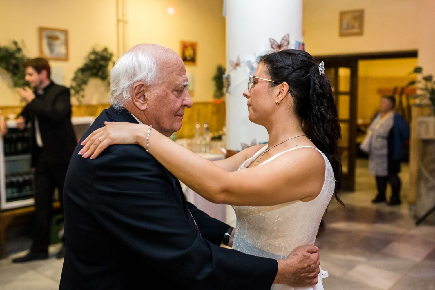 A series of dance photos showing couples embracing and dancing together at an indoor event.