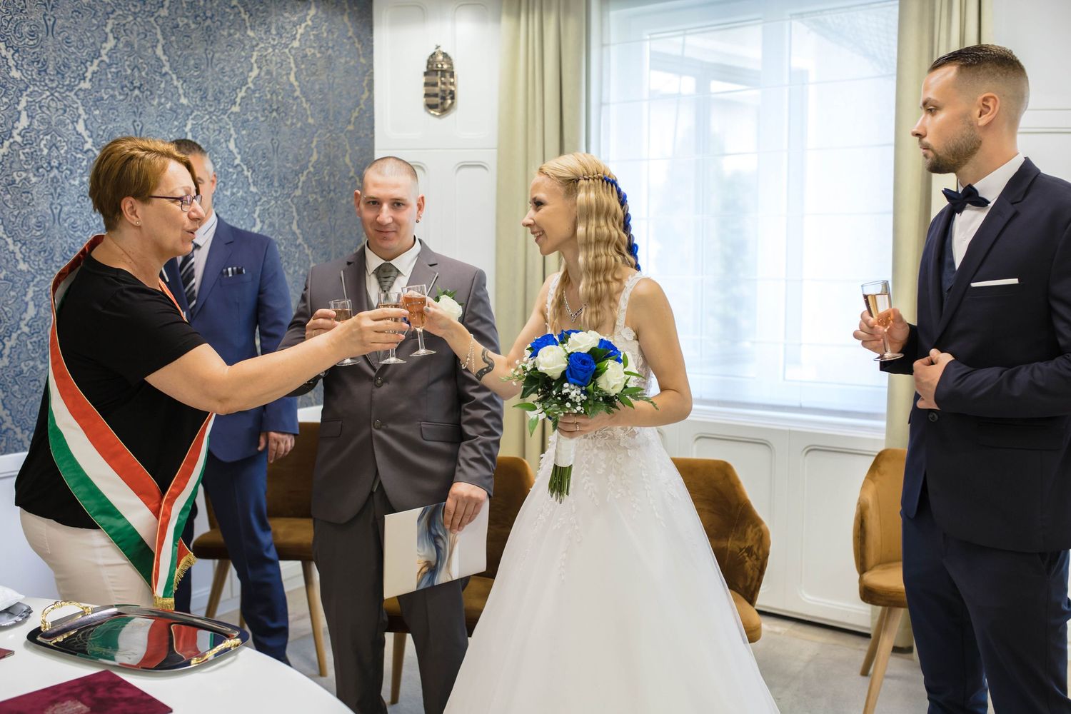A wedding ceremony montage showing multiple candid moments of celebration and toasts between guests and newlyweds.