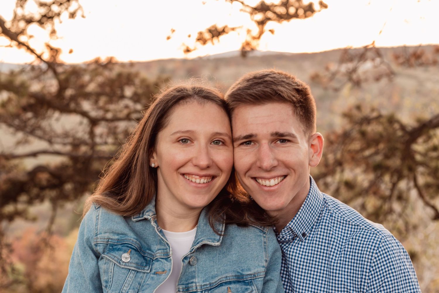 Casual outdoor portraits of a couple wearing denim and blue against a natural backdrop.