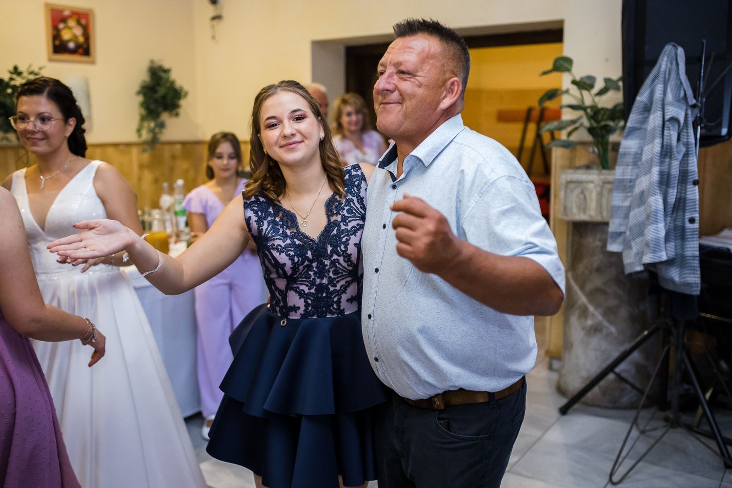 A series of wedding reception photos showing couples dancing together in an indoor venue.